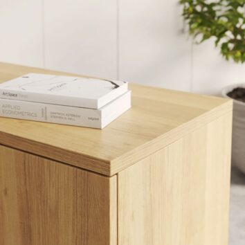 Armoire en bois mélaminé monobloc pour rangement bureau, H73 L100, avec livres posés sur le dessus.