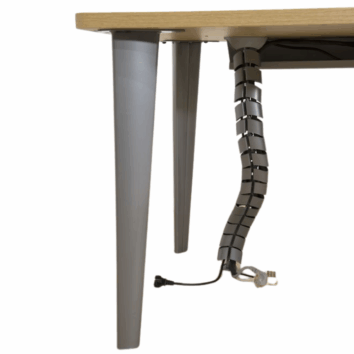 Vertèbre passe-câbles moderne sous un bureau, intégrant la gamme ligne élégance pour une gestion discrète des fils.